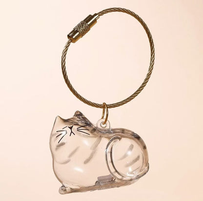 💥 Buy 1 Get 1 Free — Transparent Pet Storage Capsule Keychains 🐱